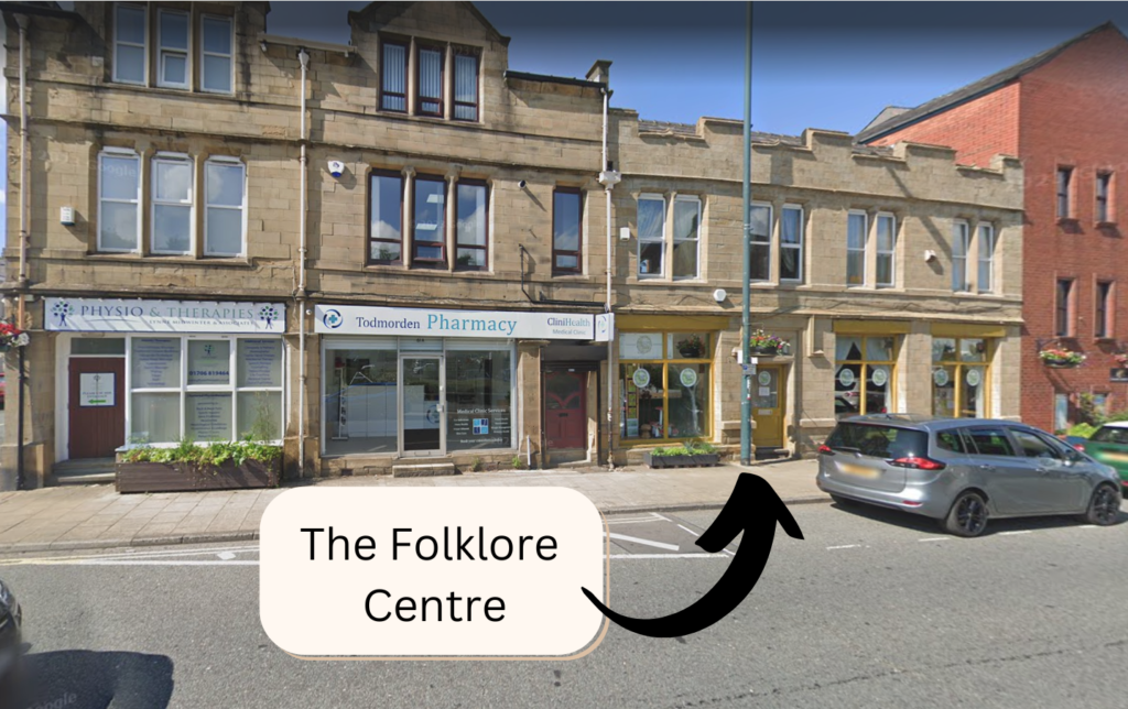 Google maps photo of the outside of the Folklore Centre on Halifax Road. There is an arrow pointing to the front door and a box with text reading "The Folklore Centre".